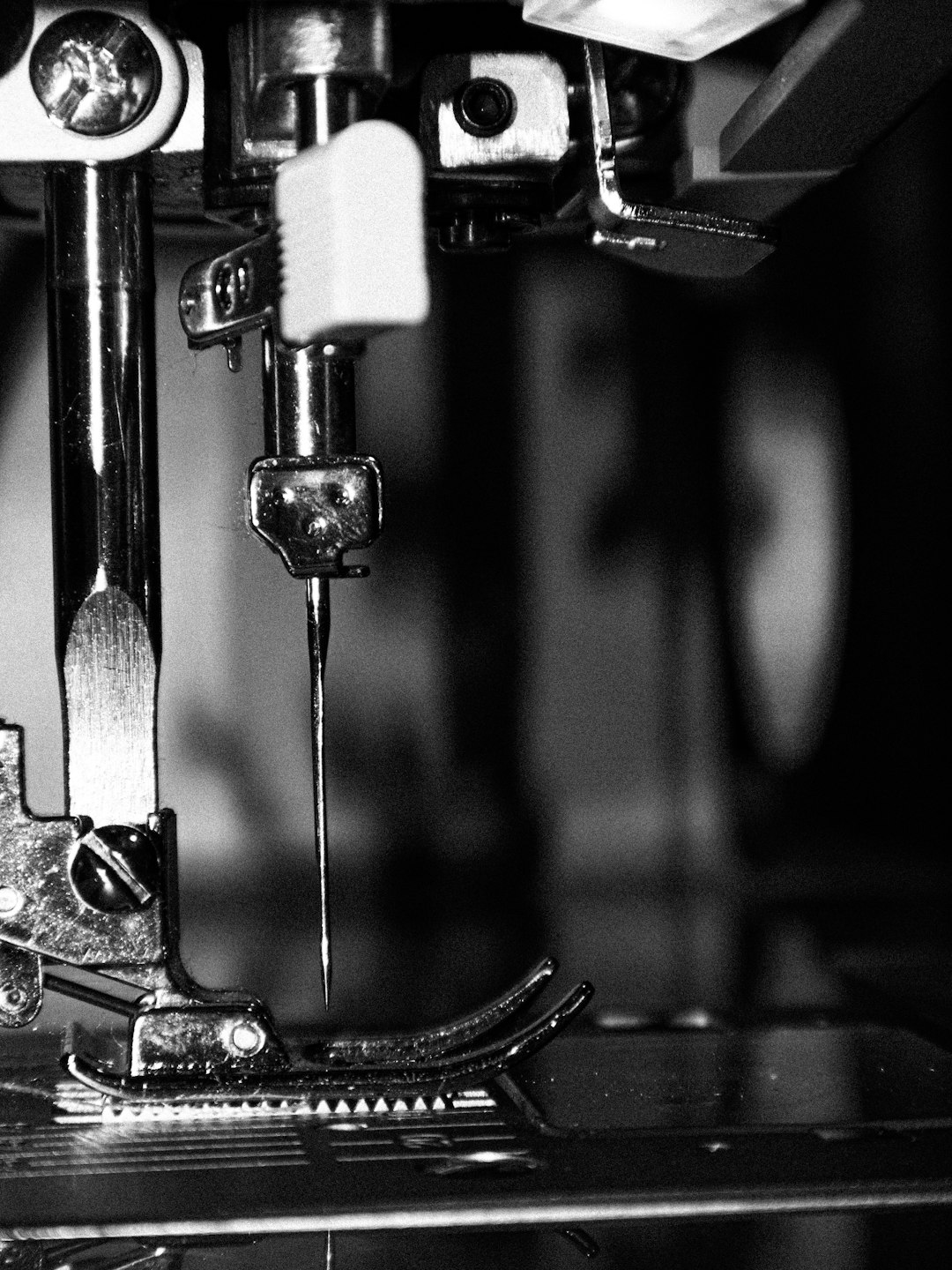 close-up-of-a-sewing-machine-needle-and-needle-wr9b5wmfu4o